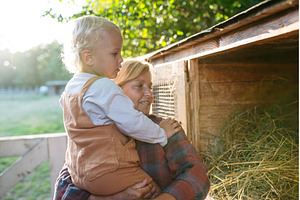 Grandmother showing farm animals to, an Animal Photo by HalfPoint