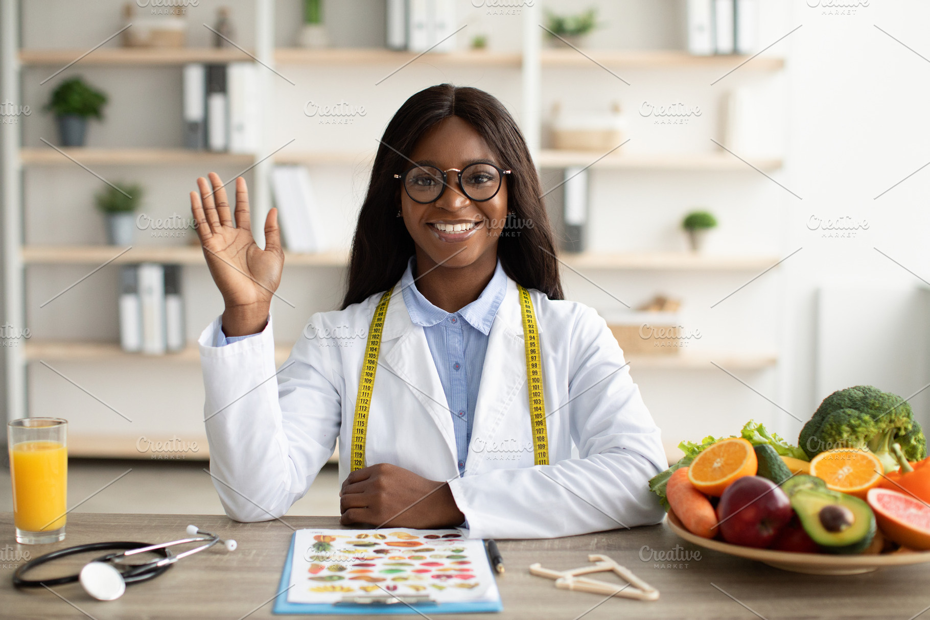 Portrait of happy african american nutritionist giving online consultations to, a Person Photo by Prostock-Studio