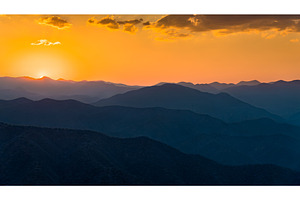 Sunset over mountains in south stock photo containing mountain and sunset, a Nature Photo by Leonid Andronov