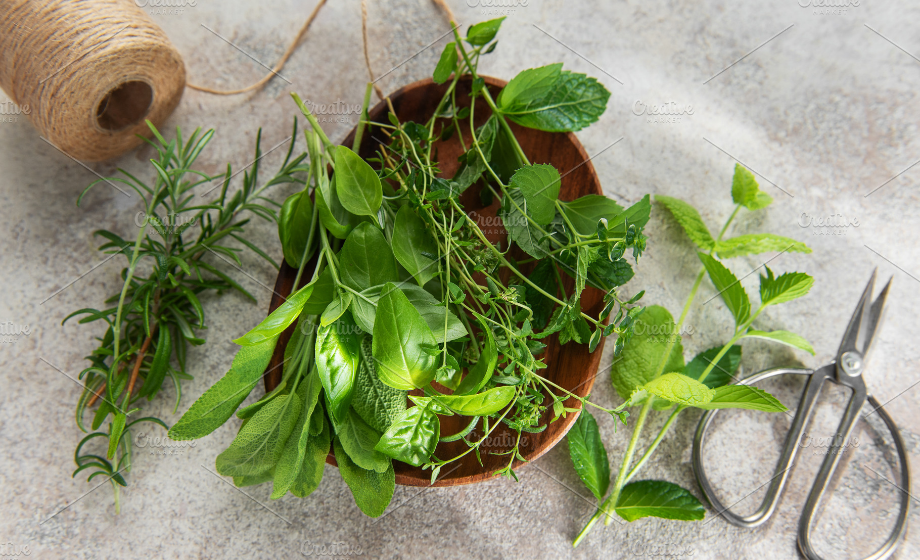Fresh herbs from garden on rustic surface with scissors, a Food & Drink Photo by Olena Rudo