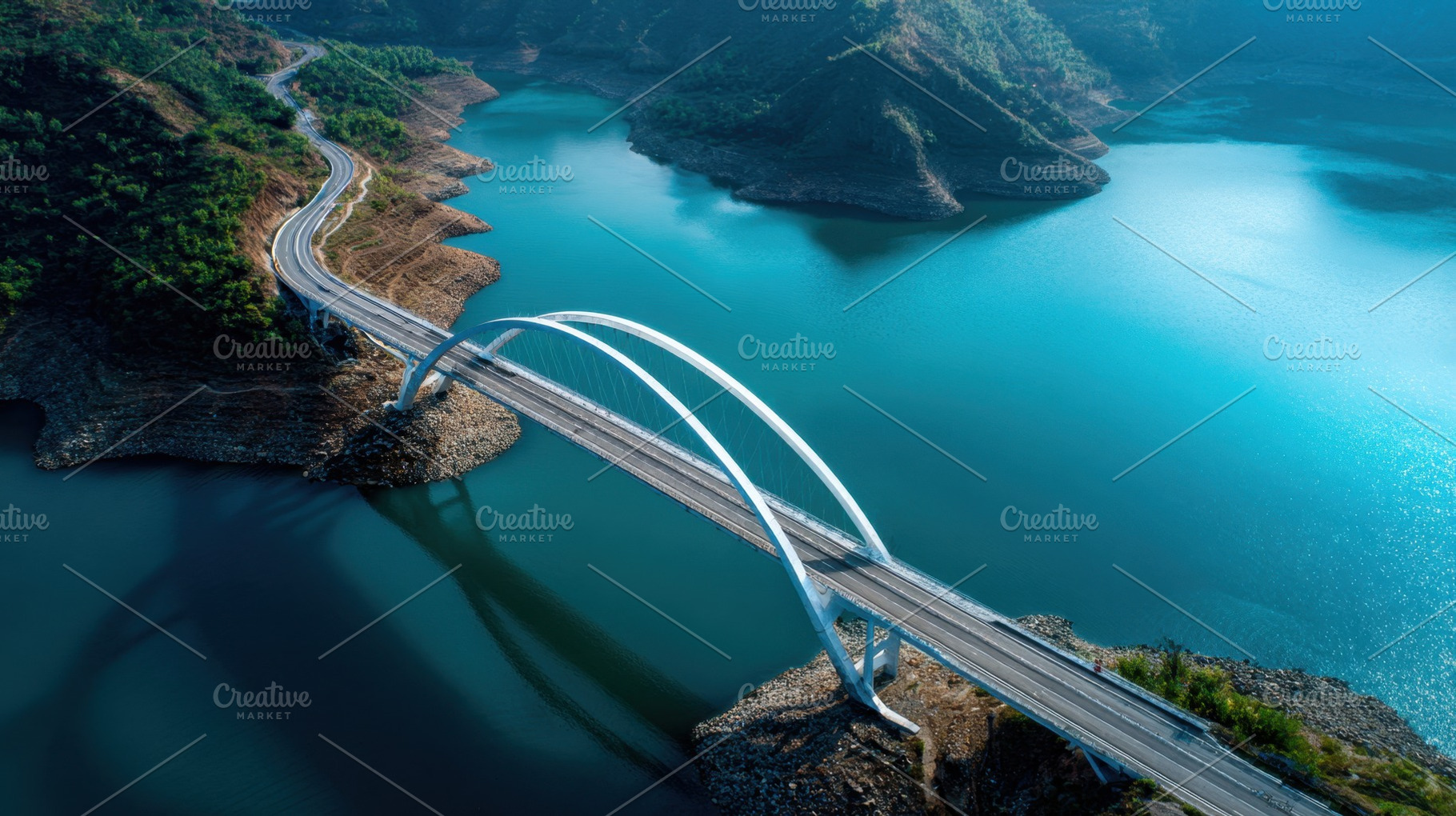 Scenic bridge over calm blue water, a Photo by Beautiful things