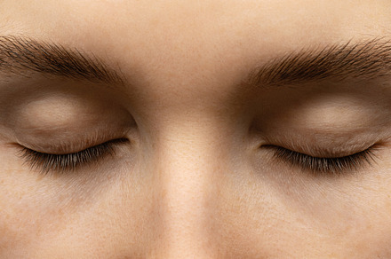 Woman's face with closed eyes.