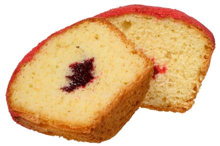 Cross section of a baked muffin red, jam filling visible in the
