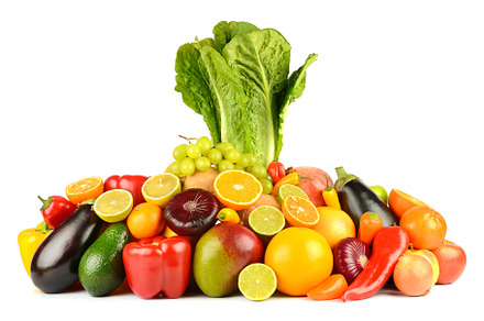 Bright fresh fruits, vegetables and berries isolated on white