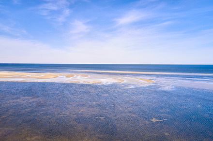 Calm beach and sea, a Photo by Peopleimages.com