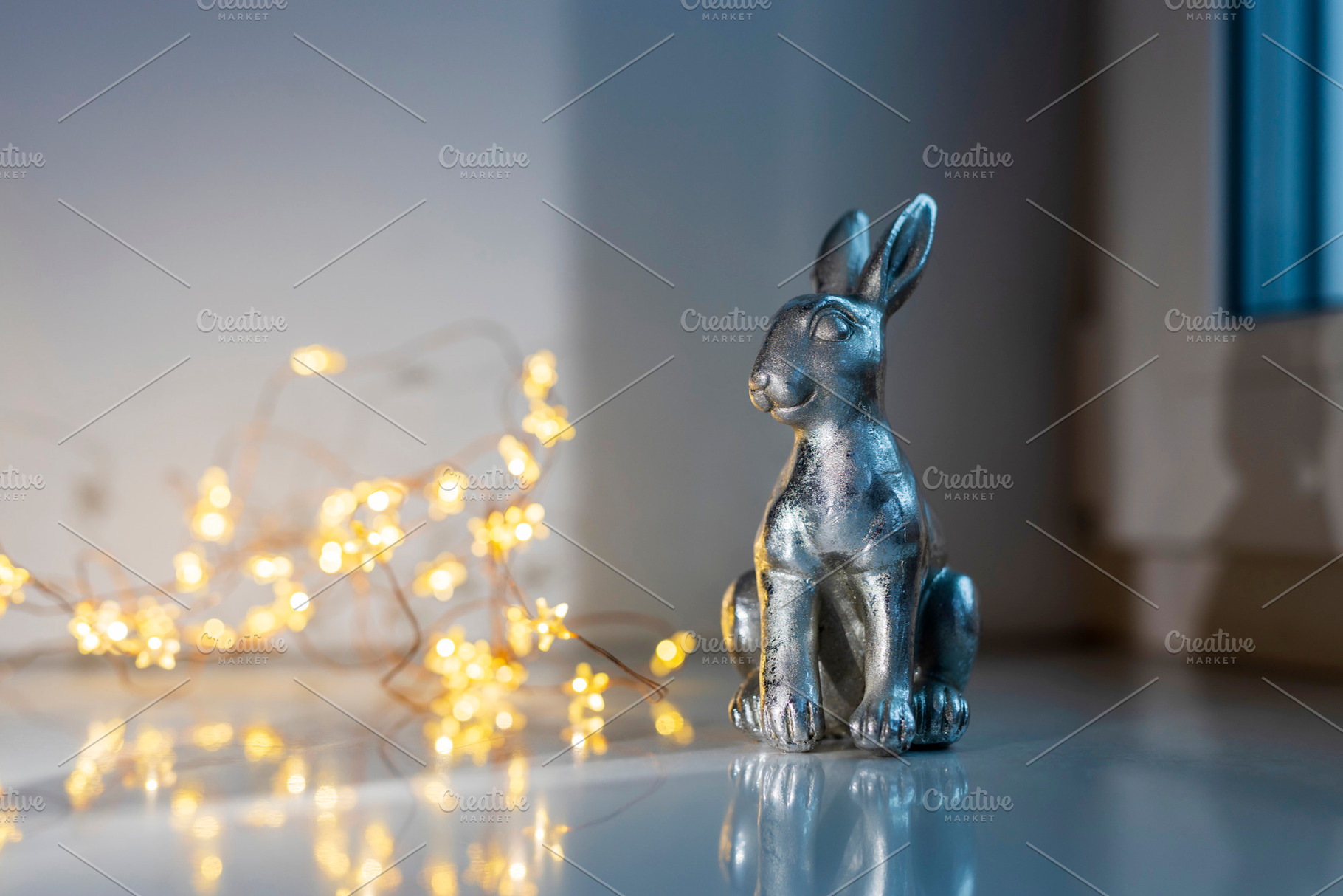 A single silver-colored rabbit figur, a Holiday Photo by Imaginarium