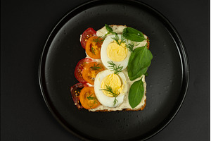 Diet sandwich on a black plate, a Food & Drink Photo by Stockphoto by vzwer