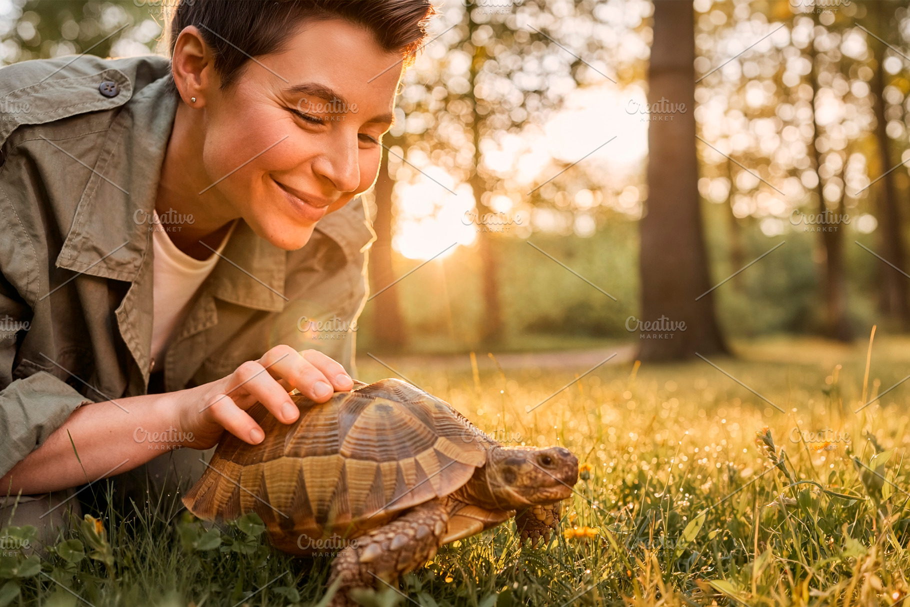 Adult woman petting tortoise at sunset, a Person Photo by DanFLCreativo