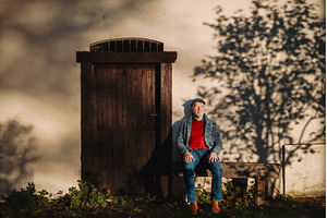 Older man enjoying warm autumn sun, a Person Photo by HalfPoint