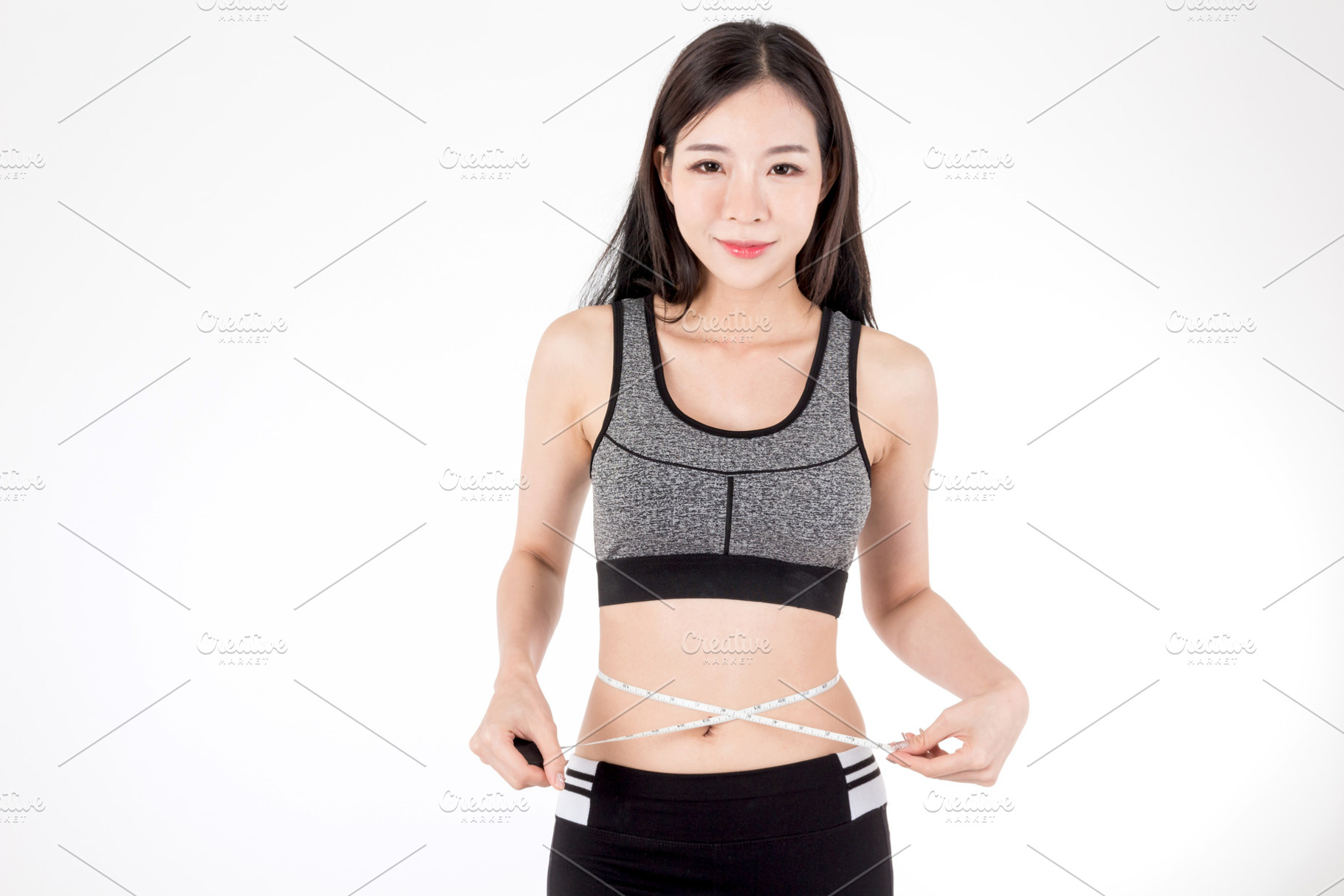 Woman slim measuring her waist containing woman, body, and girl, a Person Photo by Art_Photo