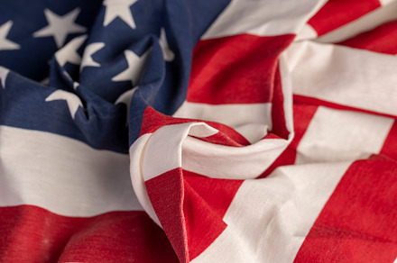part of the American flag with stars and red and white stripes, a Photo by MyPhotos