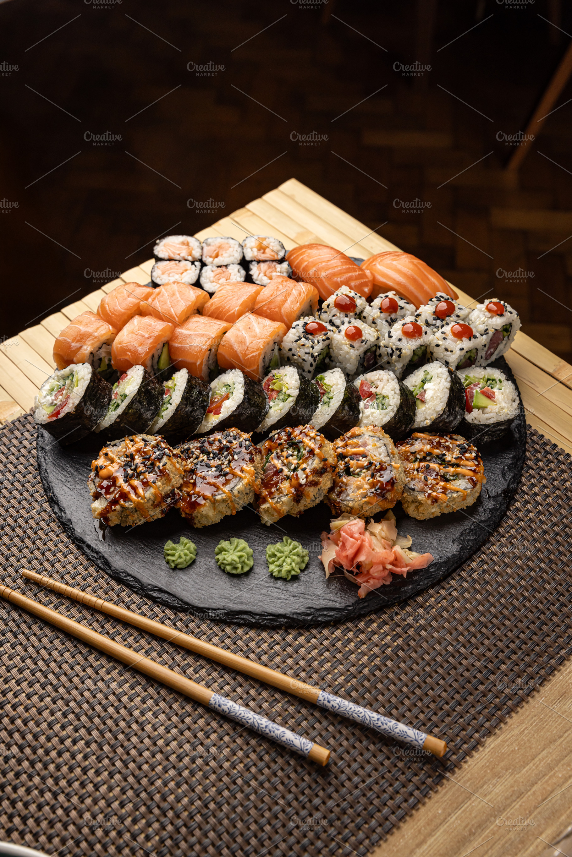 Sushi platter with various rolls, a Photo by Grafvision photography
