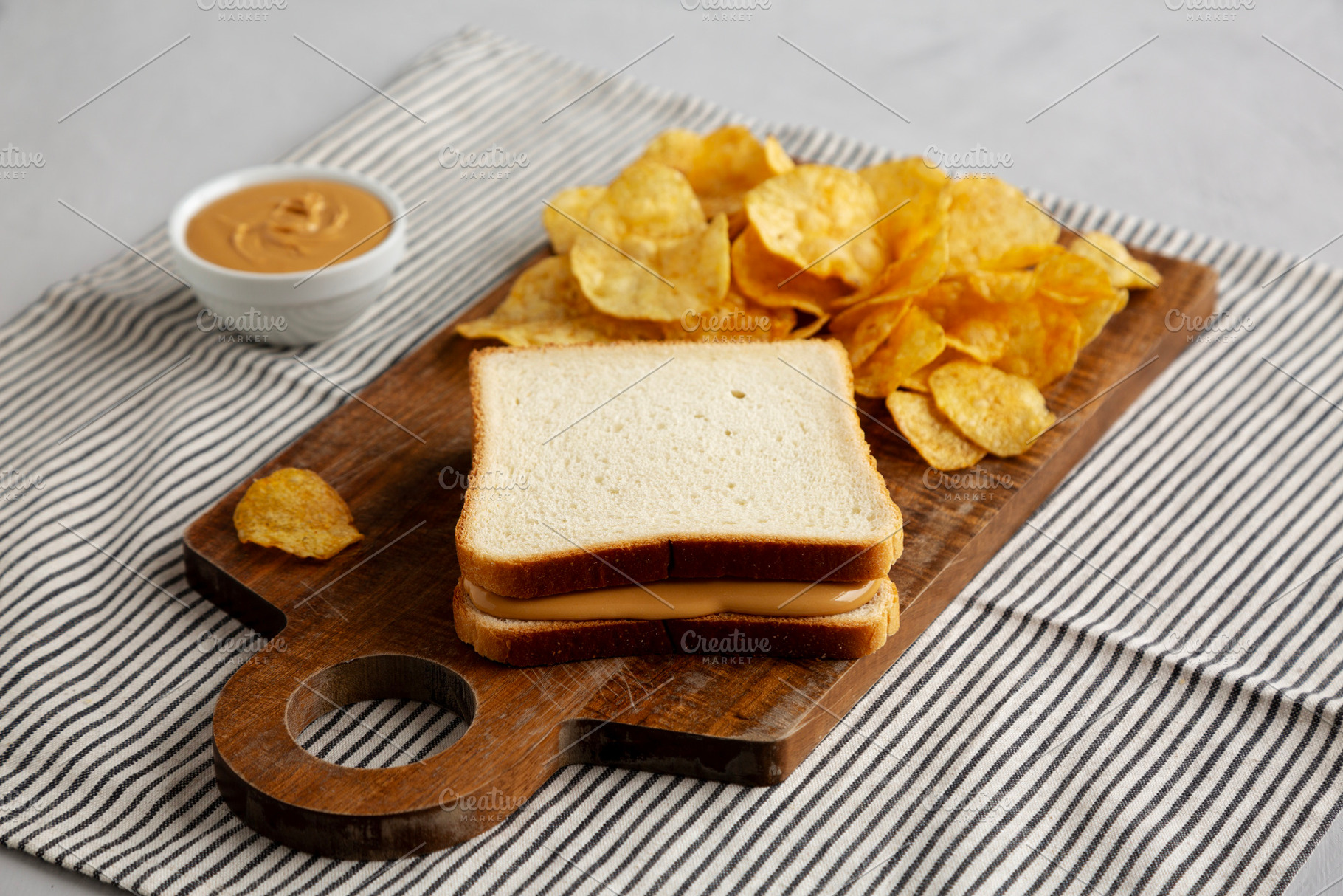 Homemade American Peanut Butter Sandwich on a Wooden Board, side, a Food & Drink Photo by LiudmylaChuhunova