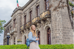 Young woman tourist standing near, an Architecture Photo by Elizaveta Galitskaya