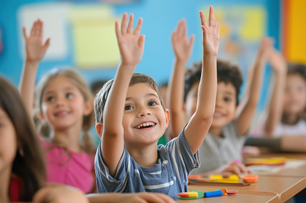 School children raising their hands, a Photo by Pavel_design