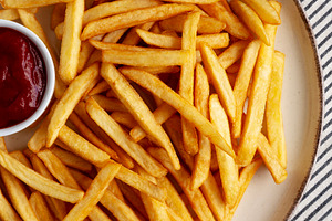 Homemade Golden French Fries with Ketchup, top view. Close-up., a Food & Drink Photo by LiudmylaChuhunova