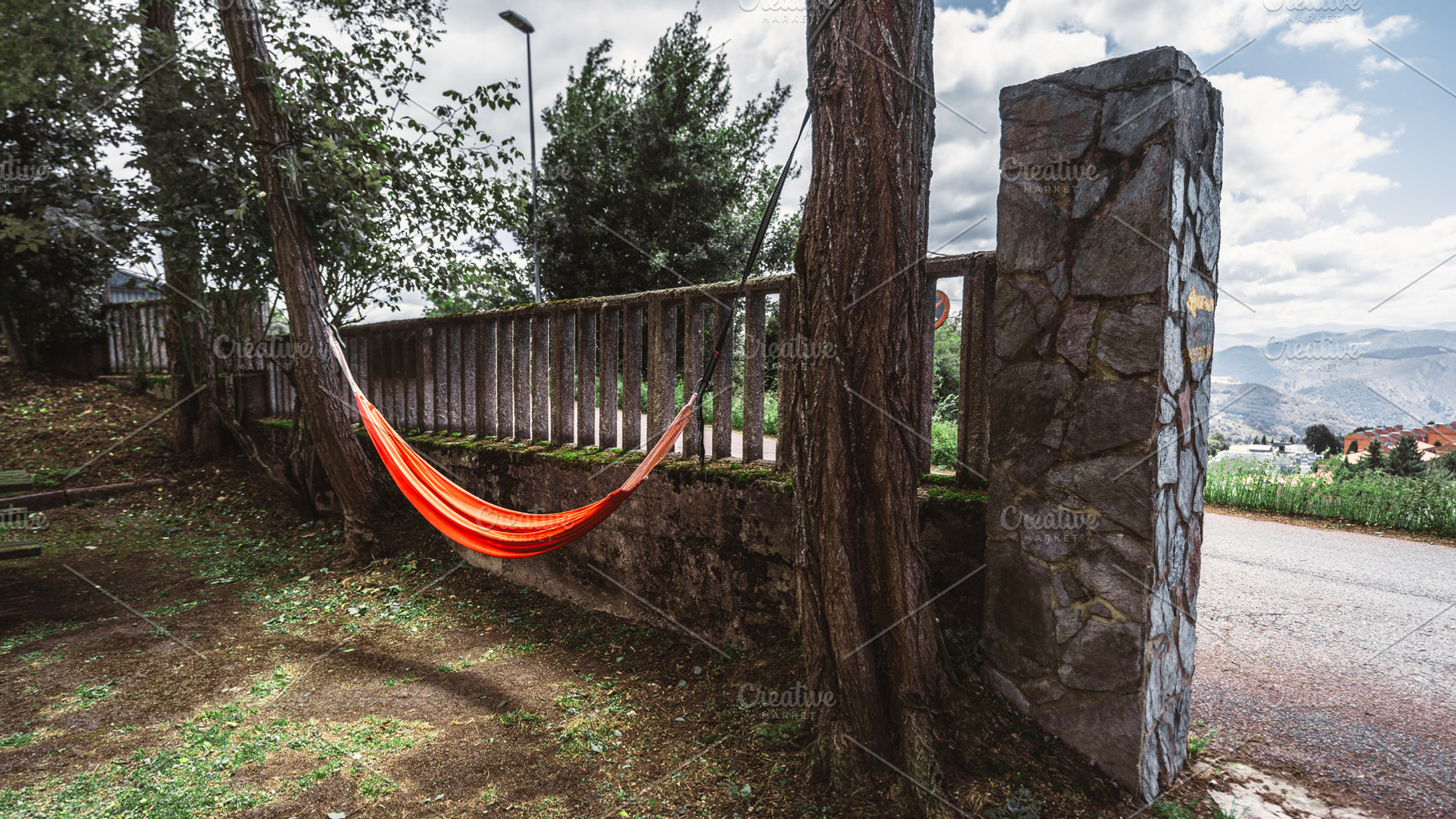 Orange hammock by stone wall, a Sports & Recreation Photo by SkyNext