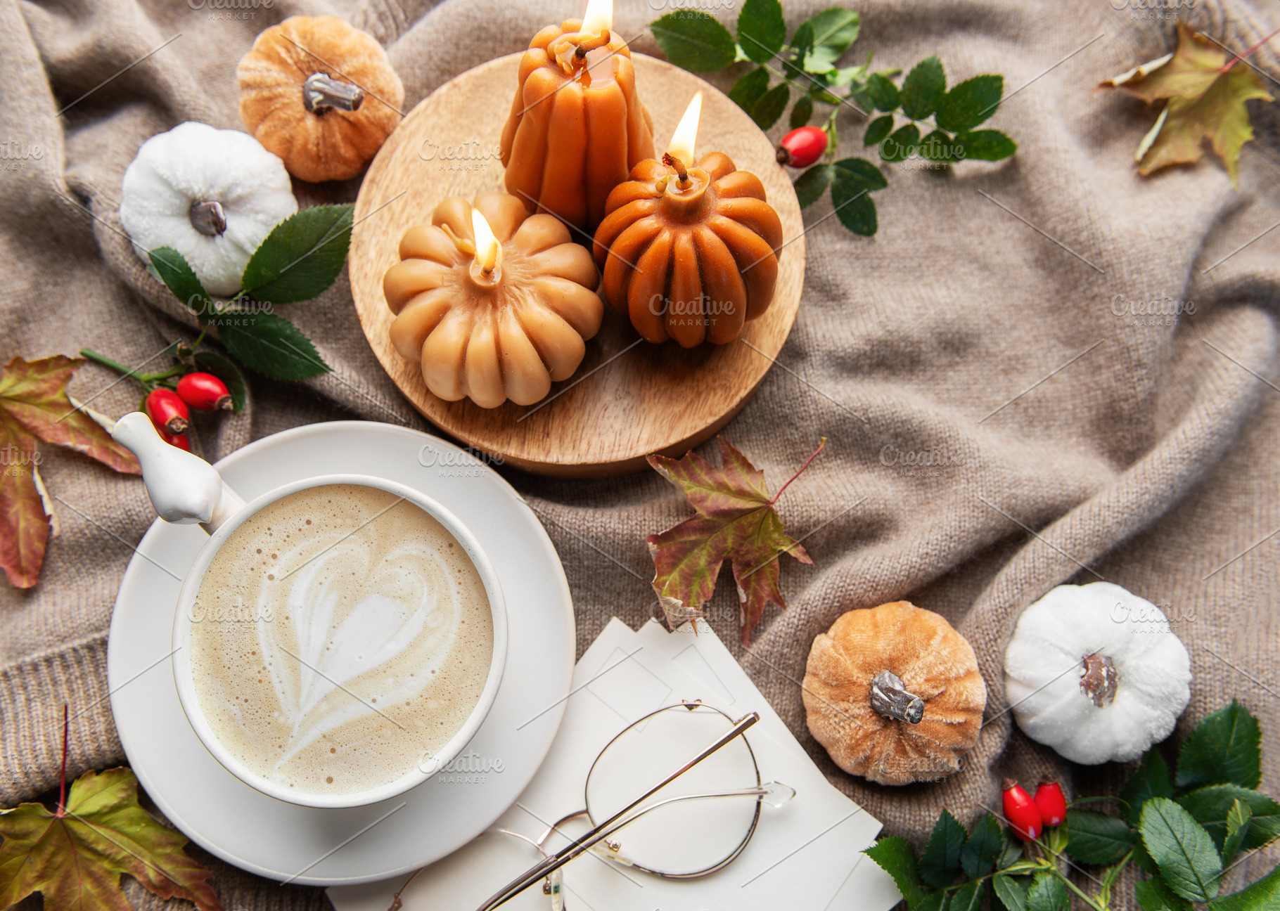 Autumn hygge flat lay with coffee and pumpkin candles, a Holiday Photo by Olena Rudo