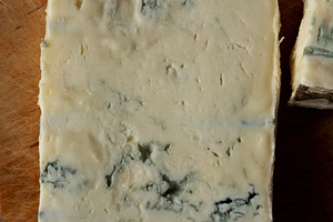 Blue cheese Gorgonzola on a Wooden Board, top view., a Food & Drink Photo by LiudmylaChuhunova