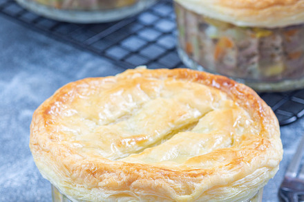 Individual beef pot pies or deep dish pies in ramekin and on cooling rack, vert, a Food & Drink Photo by iuliia_n