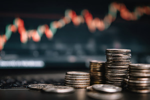 Stacks of coins and stock market gra, a Photo by Pixeness Studio