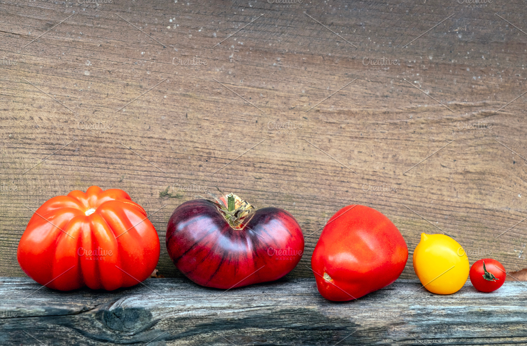 Different tomatoes lined up, a Food & Drink Photo by BOOCYS