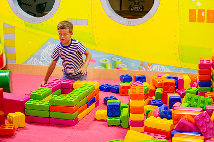 boy playing with building toy blocks