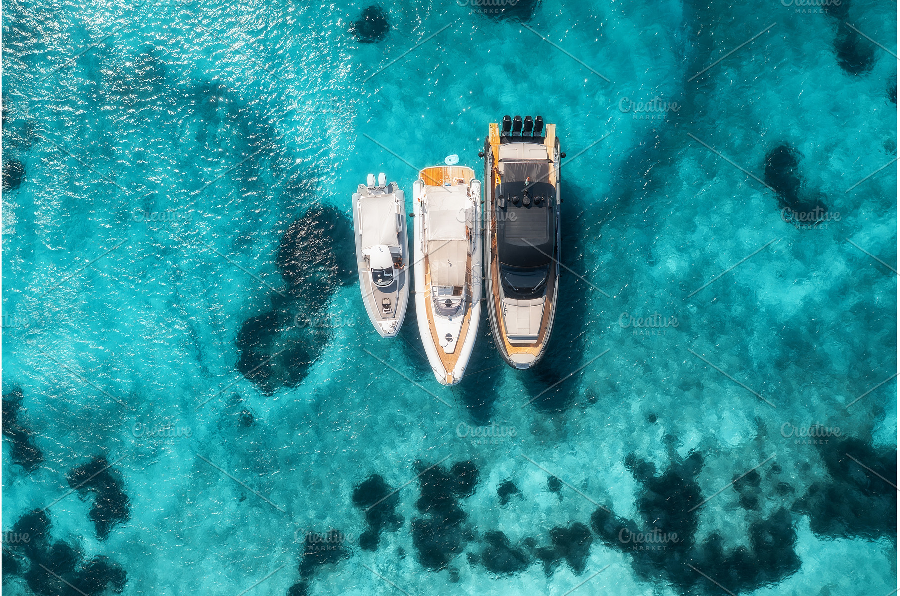 Aerial view of three yachts on, a Nature Photo by den-belitsky