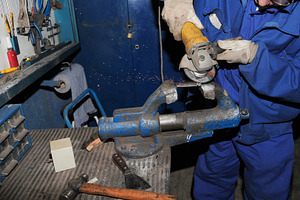 Worker Grinding Metal with Angle Grinder in Workshop, an Industrial Photo by Davizro's Market