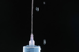 Dynamic Splash of Liquid Ejecting from a Syringe Needle., a Photo by Rohan Photography
