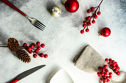 Christmas table setting containing arrangement, background, and ball, a Food & Drink Photo by Anna Bogush