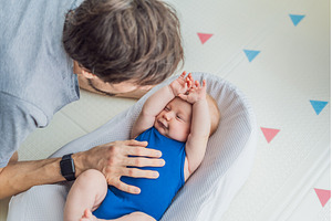 Loving father interacts with his 3, a Person Photo by Elizaveta Galitskaya