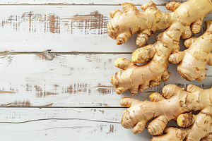 Fresh ginger root on wooden table, a Food & Drink Photo by AlyaAnd