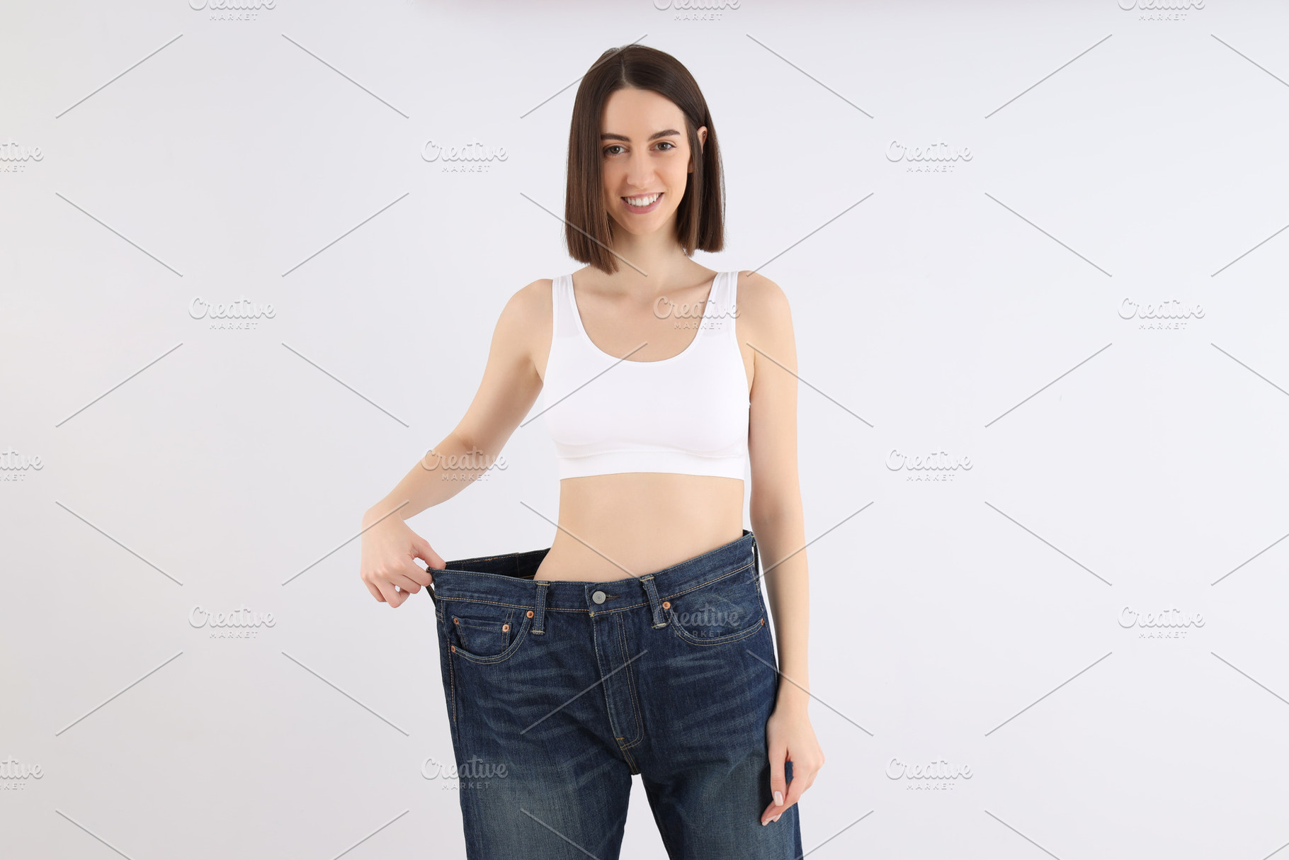 Concept of weight loss with slim girl, a Person Photo by AtlasStudio