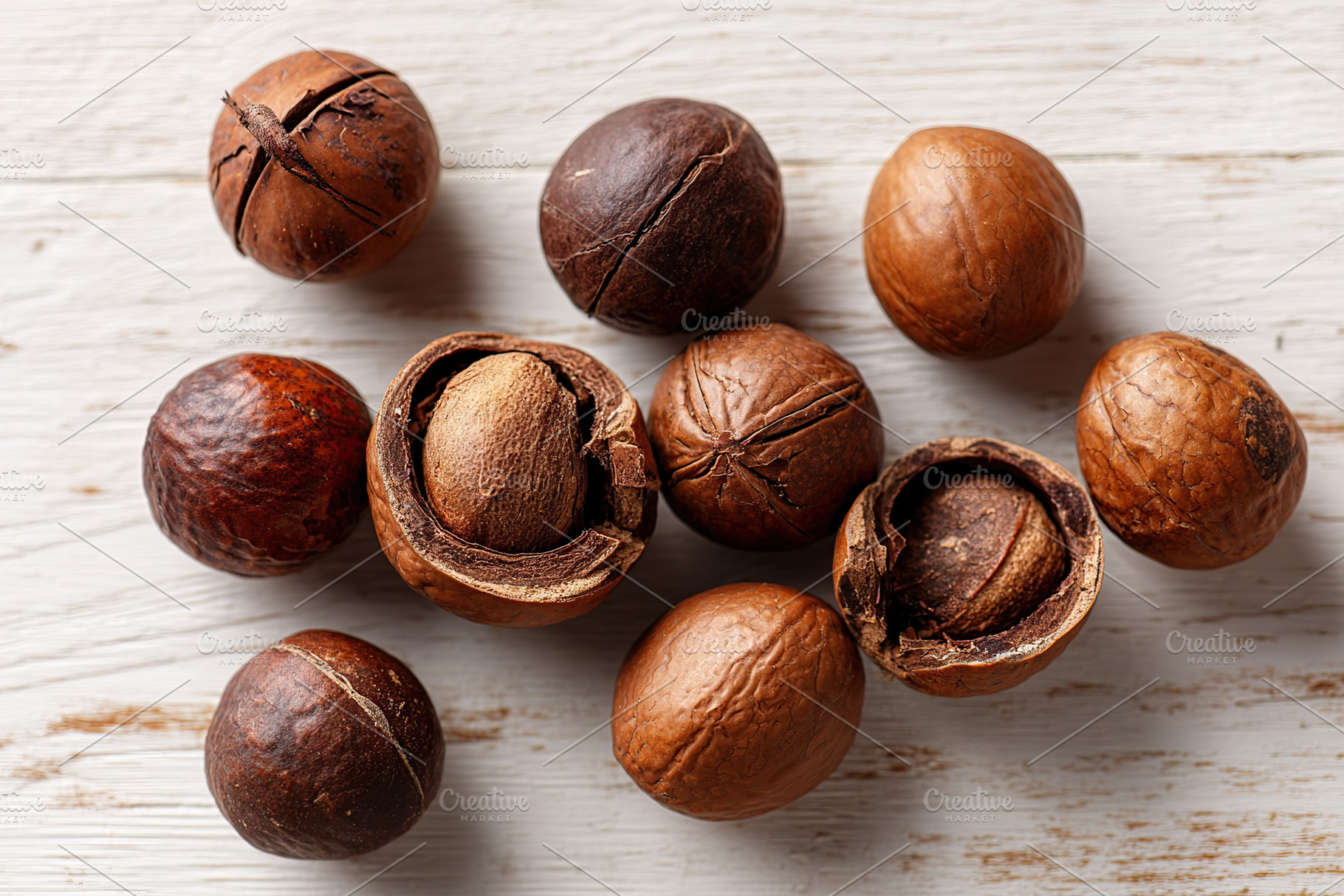 Different varieties of nuts displayed on a rustic wooden background, a Food & Drink Photo by AlyaAnd