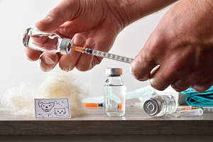Nurse loading a syringe with vaccine for pet allergies, a Health & Medical Photo by Davizro's Market