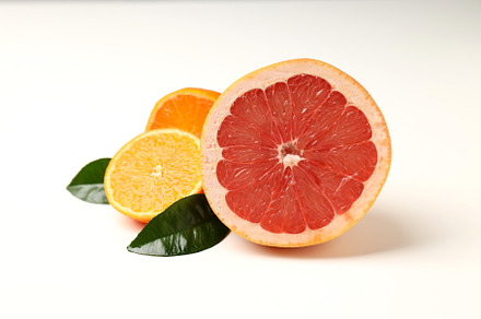 Concept of tasty food with citrus fruits on white background, a Food & Drink Photo by AtlasStudio PRO