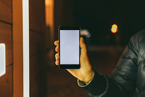 Female's hand holding mobile phone