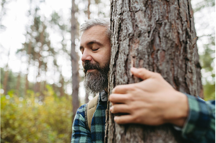 Handsome man standing in forest with, a Sports & Recreation Photo by HalfPoint