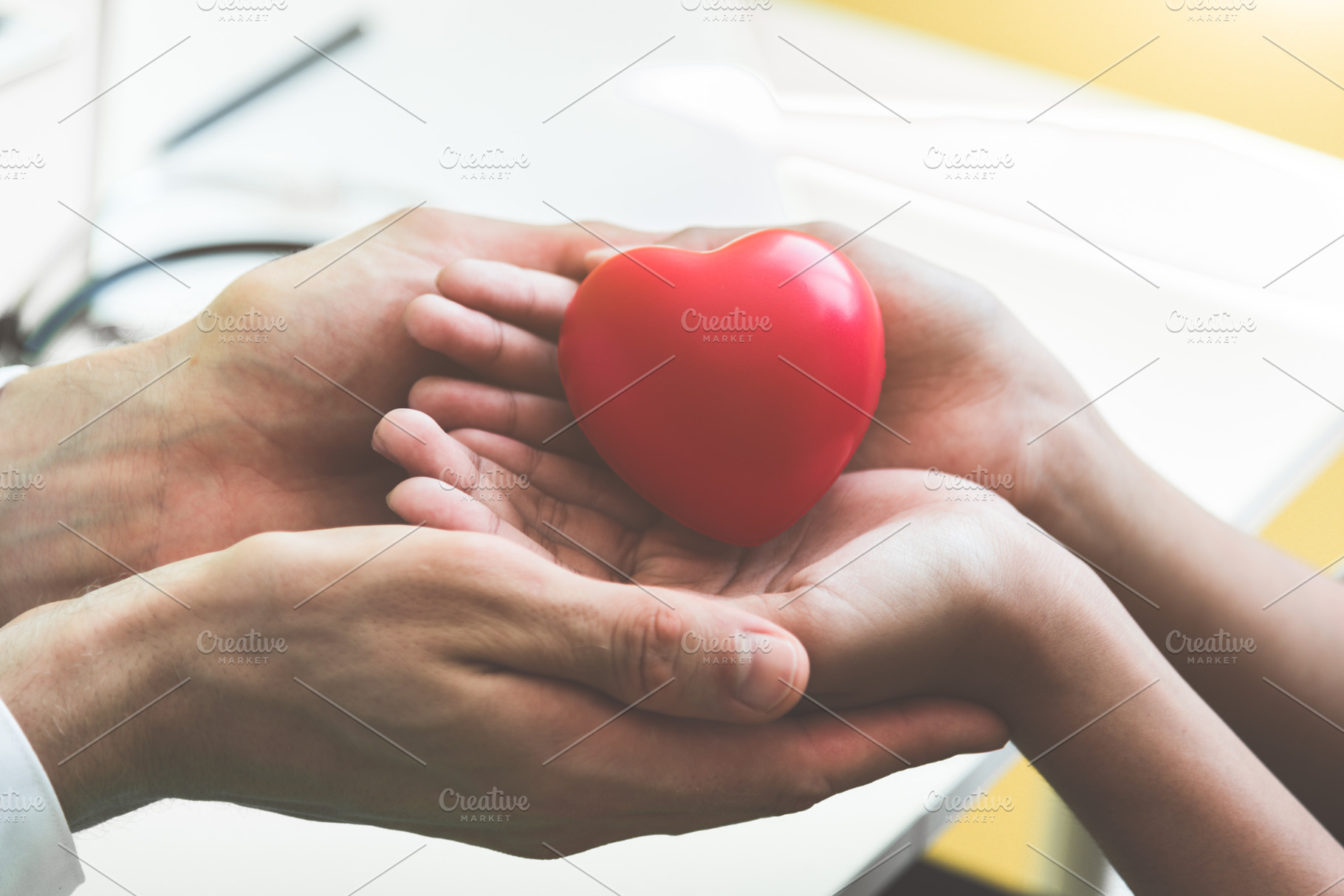 Doctor hands holding and giving red massage heart to patient lit, a Person Photo by Ministocker
