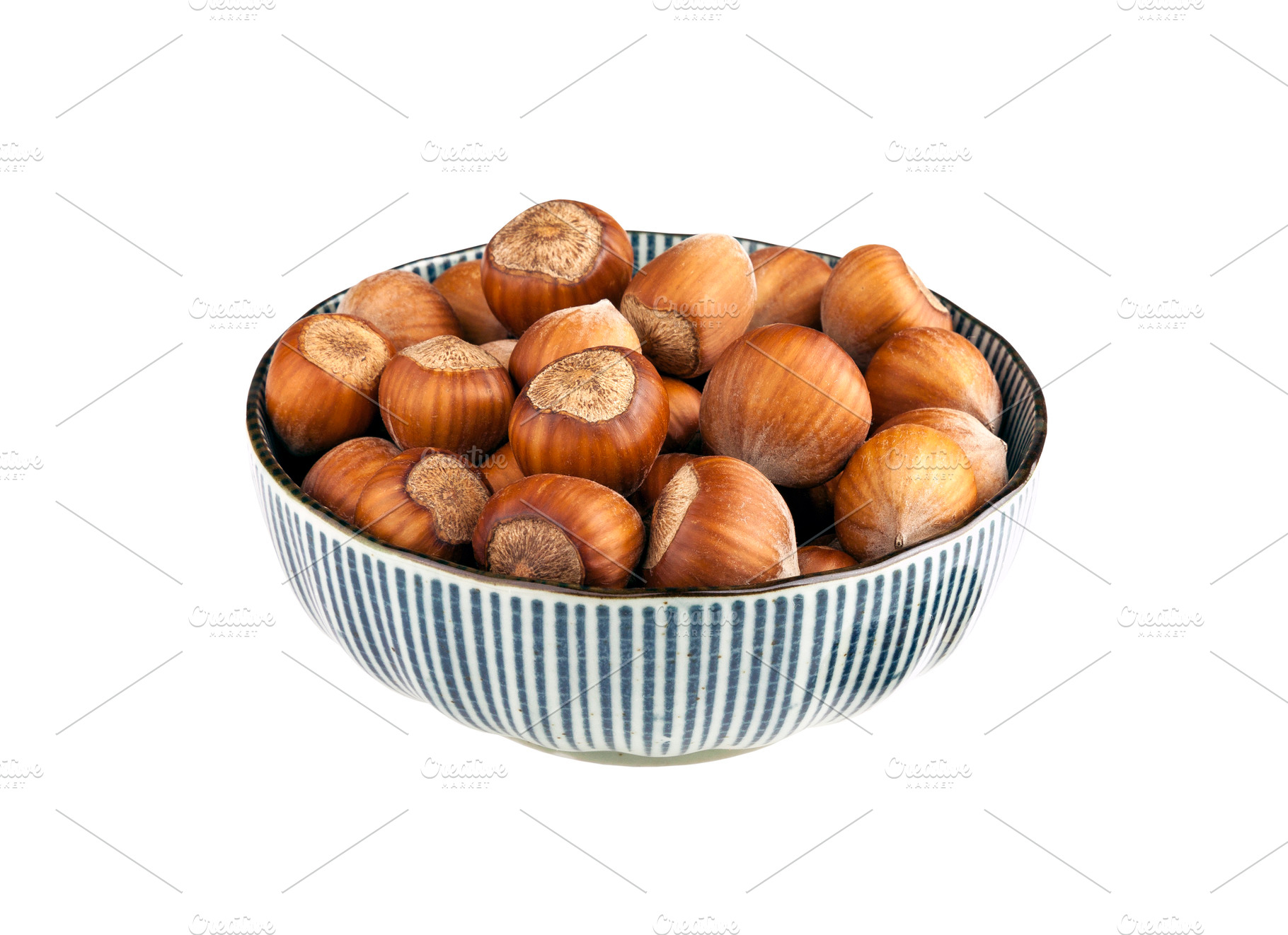 Bowl of hazelnuts isolated, a Food & Drink Photo by BOOCYS