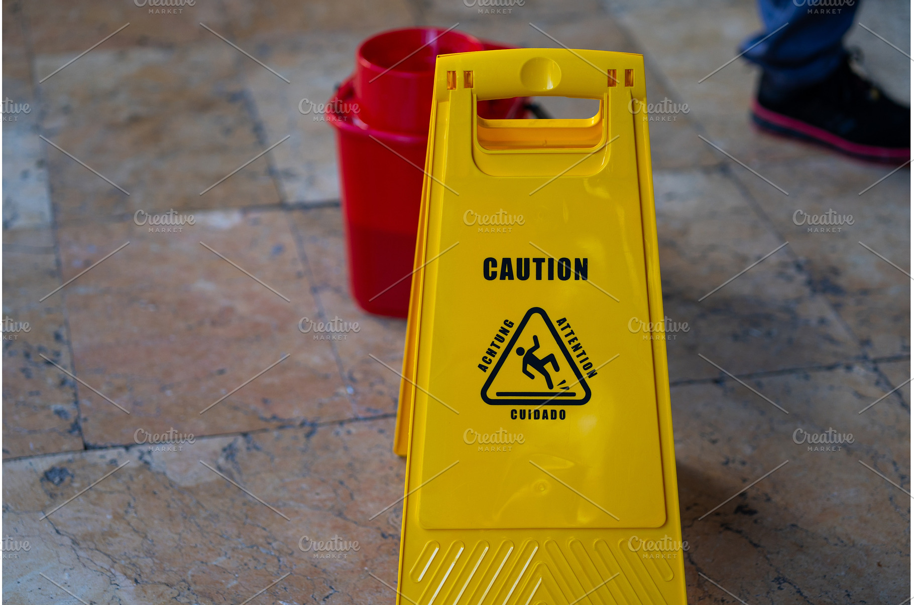 Bright yellow wet floor warning sign, an Industrial Photo by volodymyrshtun13795