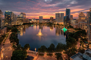 Sunset over Lake Eola Orlando skylin, a Photo by Pixeness Studio
