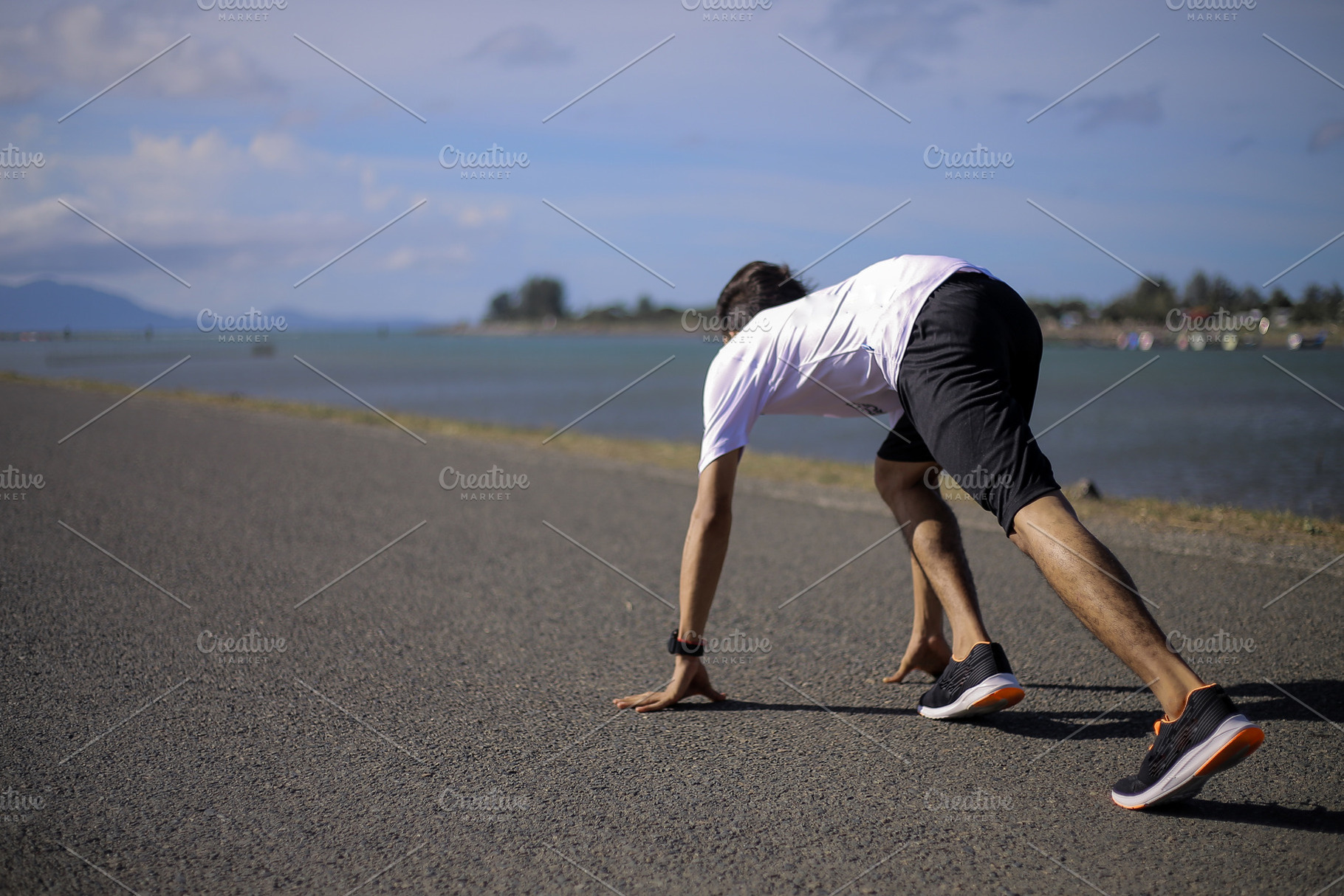 Athlete Sprinting on Coastal Road, a Sports & Recreation Photo by bastera