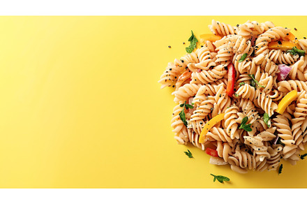 Colorful pasta salad with fusilli, a Background Photo by Sergey Kotenev