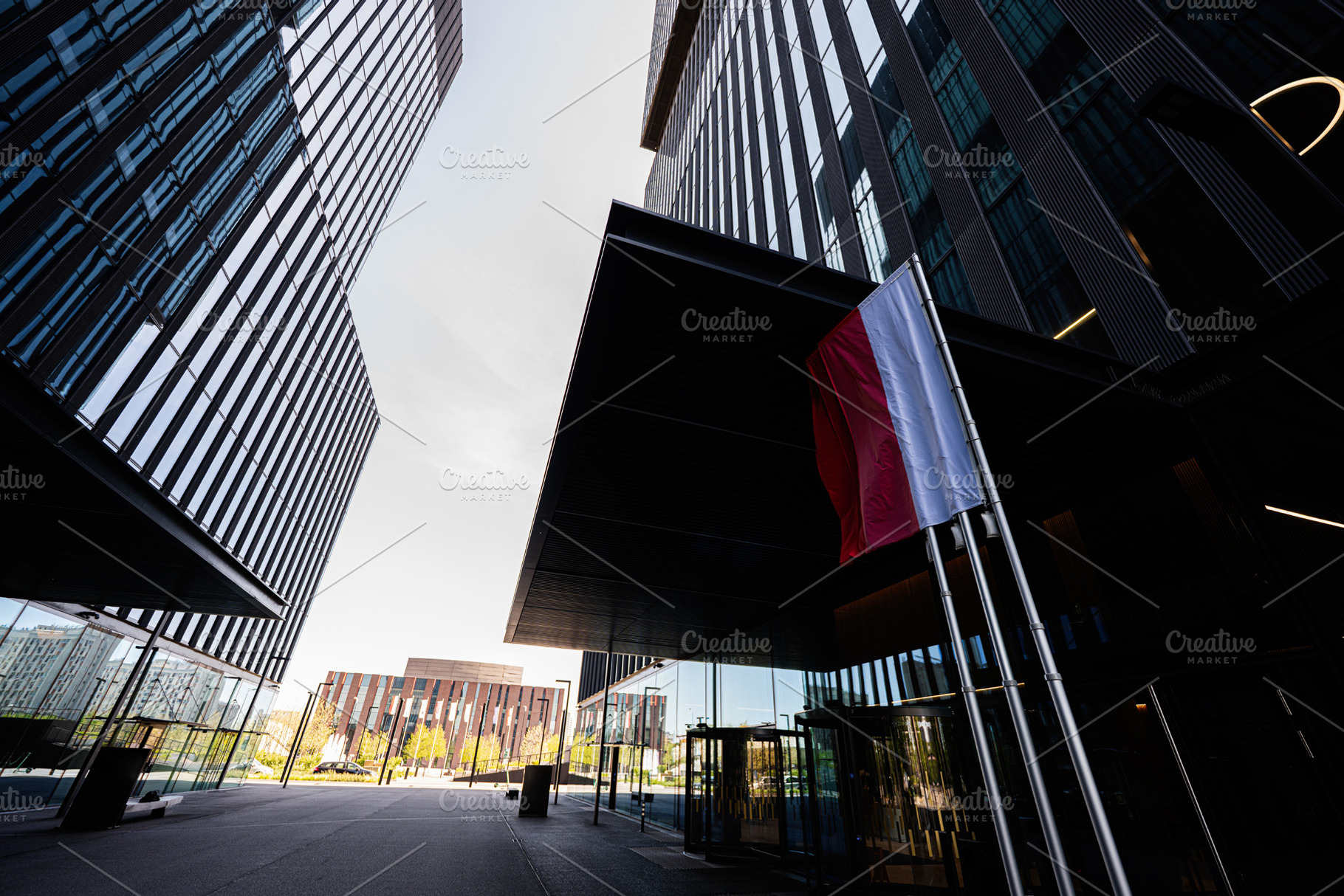 Modern business architecture with Polish flag at corporate entrance in Katowice, a Photo by AS photostudio