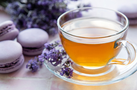 Cup of tea with macaroon dessert with lavender flavor, a Food & Drink Photo by Olena Rudo
