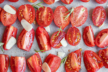 Fresh tomato slices with herbs, a Food & Drink Photo by Olena Rudo