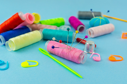 Sewing accessories on a blue bed bac, an Industrial Photo by AlexBush