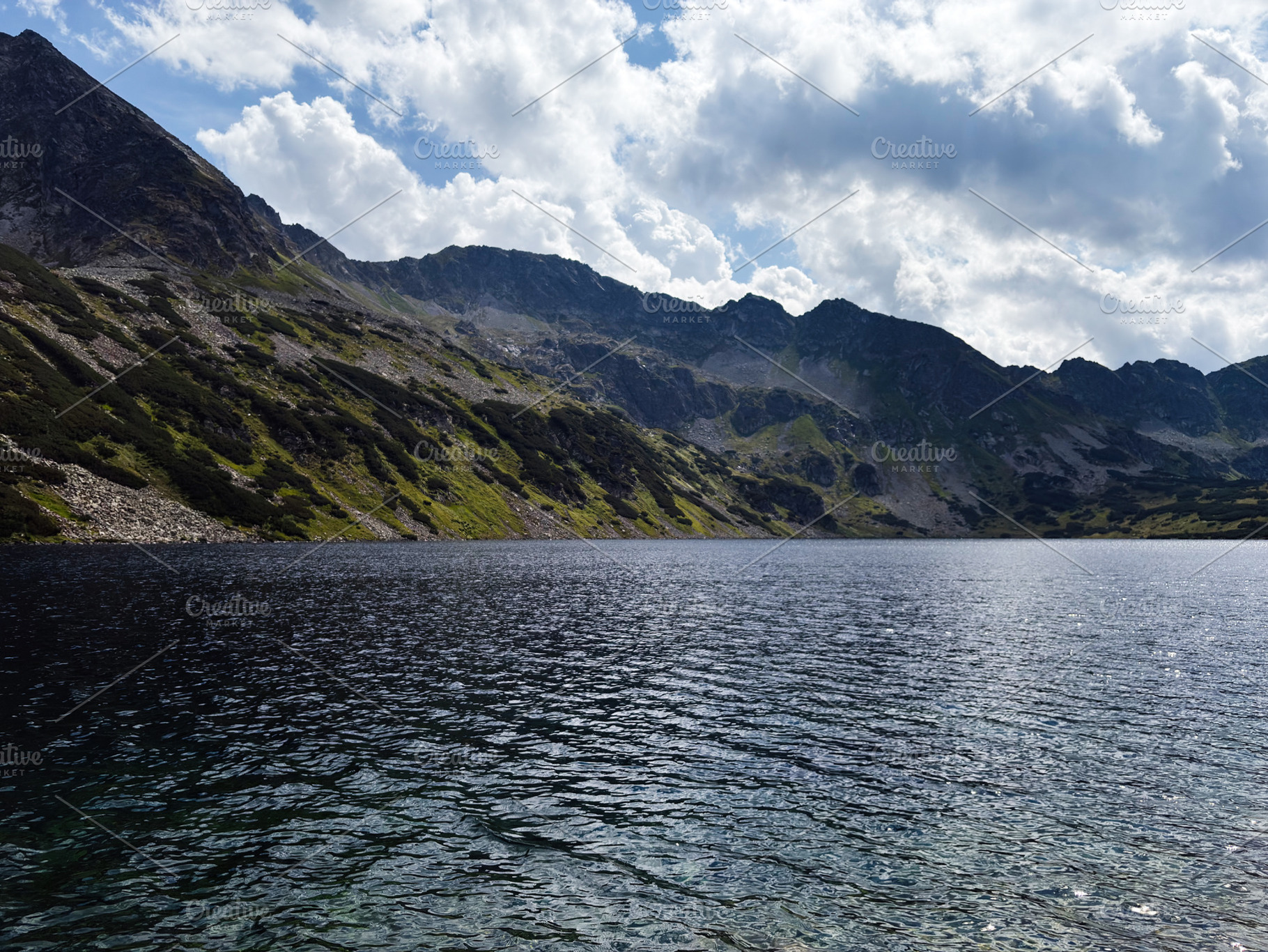 Majestic mountain lake at Zakopane Poland with rugged peaks and clear blue wate, a Nature Photo by AS photostudio